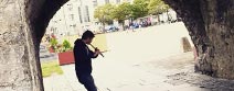 Busker playing instrument on streets