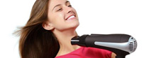 Woman drying her hair with a hair dryer
