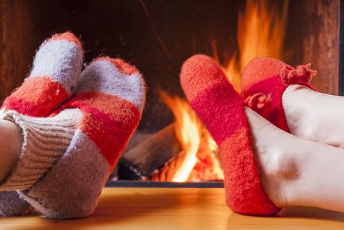 Slippers in front of warm fire 