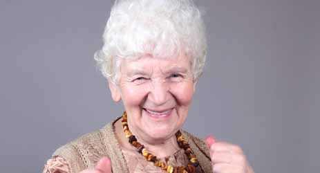 Elderly woman smiling at camera