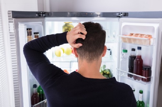 Man looking into the fridge