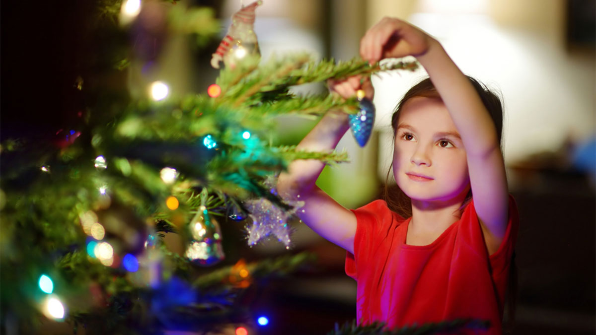 Girl Decorating Christmas Tree