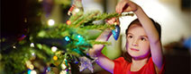 Girl Decorating Christmas Tree