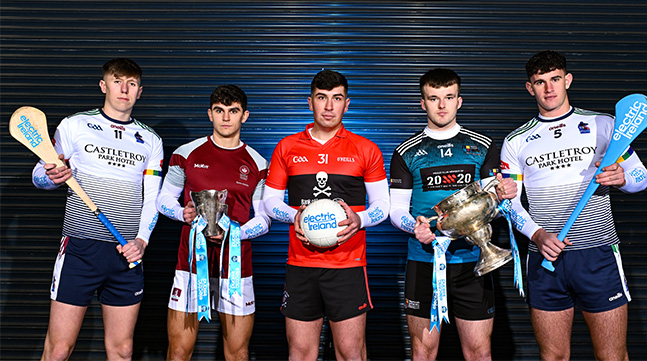 5 young GAA Championship players posing with winning trophy