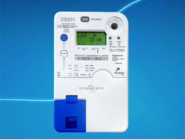 Smart meter displaying real-time energy consumption on its digital screen.